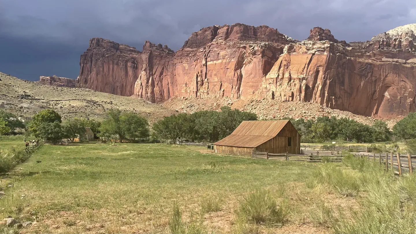 An orchard barn under the Capitol Reef cliffs.